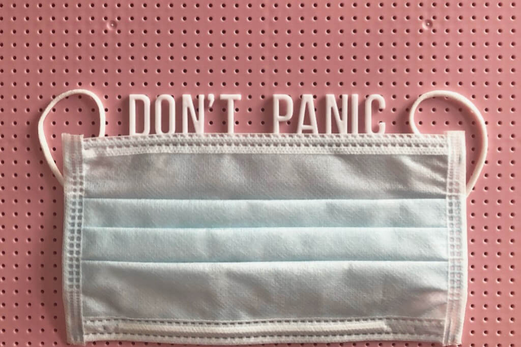 A face mask with a message saying "Don't panic."